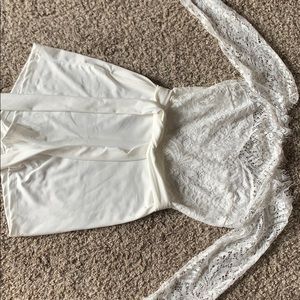 While lace off the shoulder romper